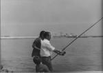 Home pescant amb canya